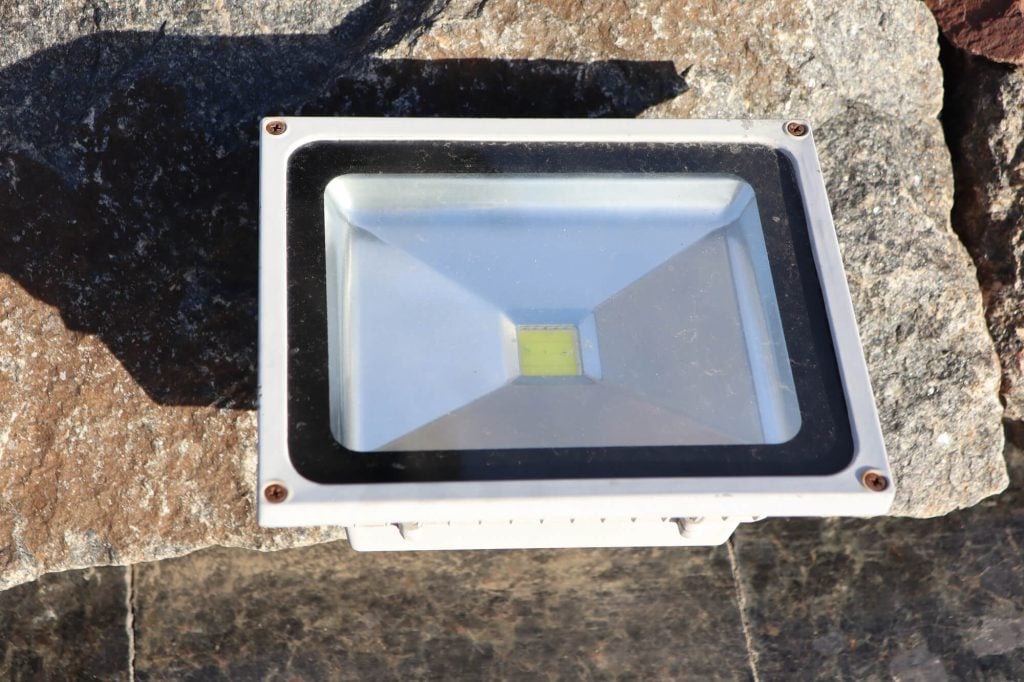An LED Floodlight on a rock